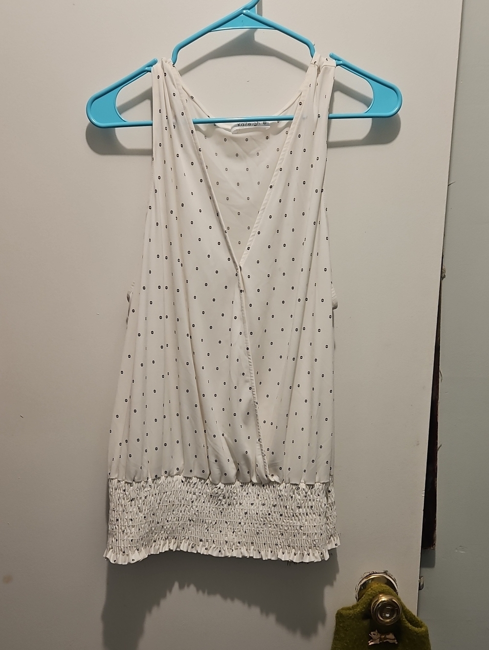 Kaileigh White Polka Dot Sleeveless V-Neck Smocked Hem Tank